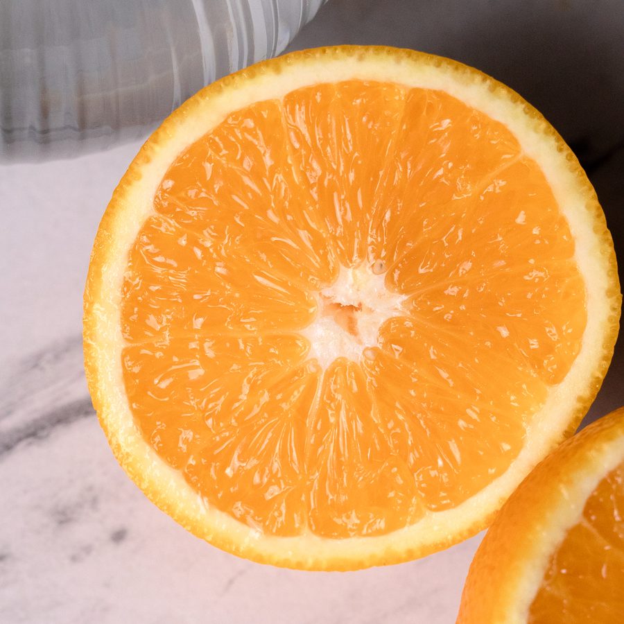 Orange halves and fresh ginger